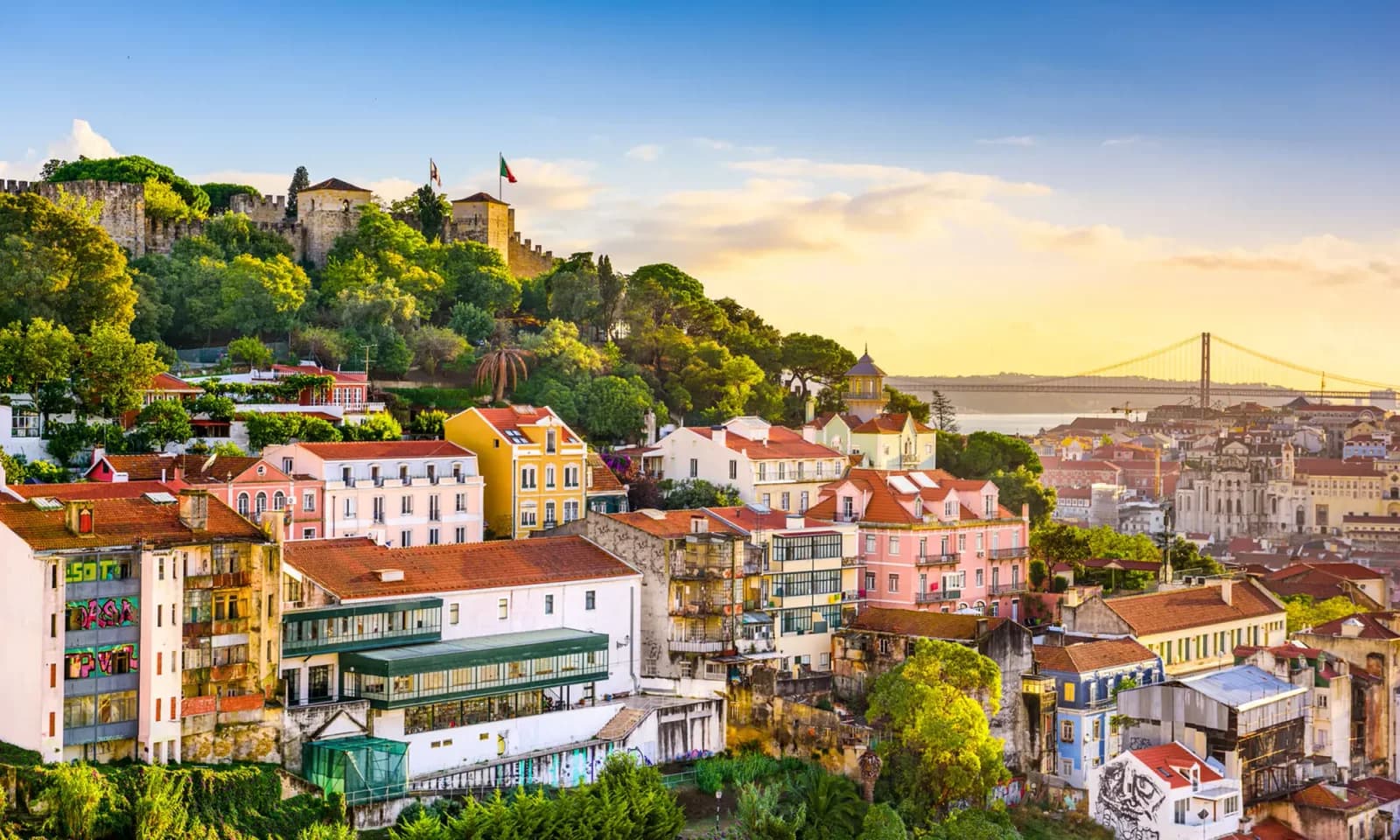 Lisbon’s old town at golden hour, from São Jorge Castle to the 25 de Abril Bridge